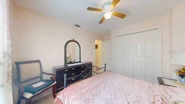 a bedroom with a bed and a dresser