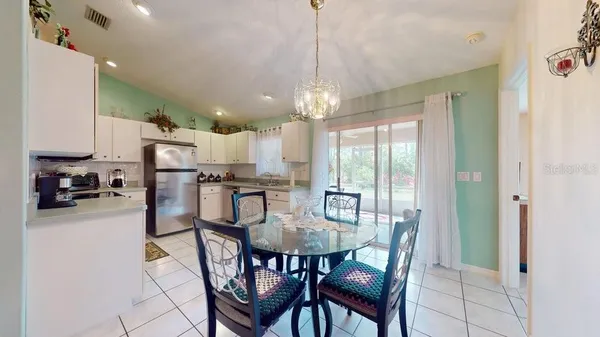 a view of a dining room with furniture window and outside view