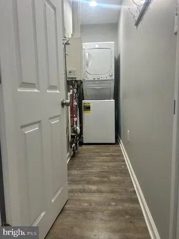 a view of a hallway with wooden walls and entryway