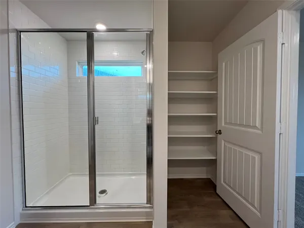 a view of an empty walk in closet