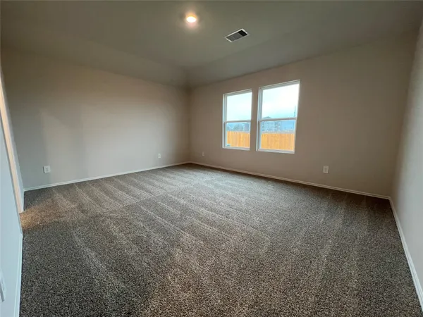 a spacious bathroom with a double vanity sink and a mirror