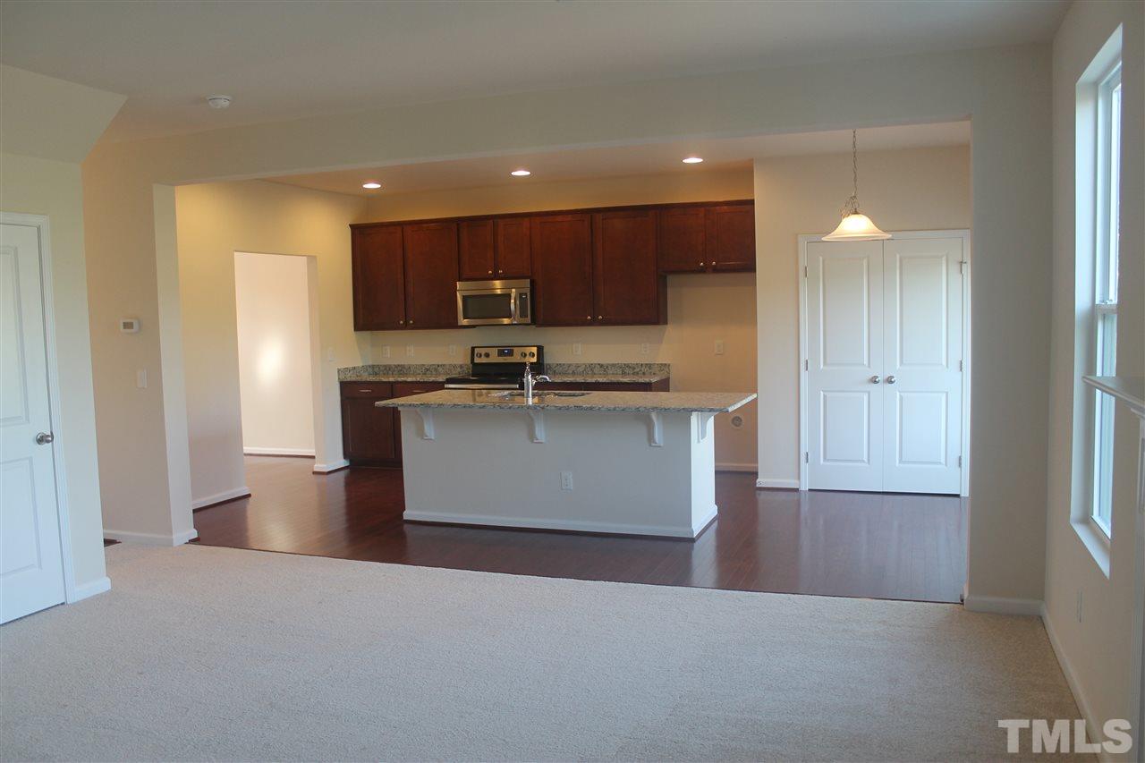 104 Hope Valley Road Knightdale, NC 27545 - Photo 8 of 15 a kitchen with stainless steel appliances granite countertop a refrigerator a sink and a stove with white countertops