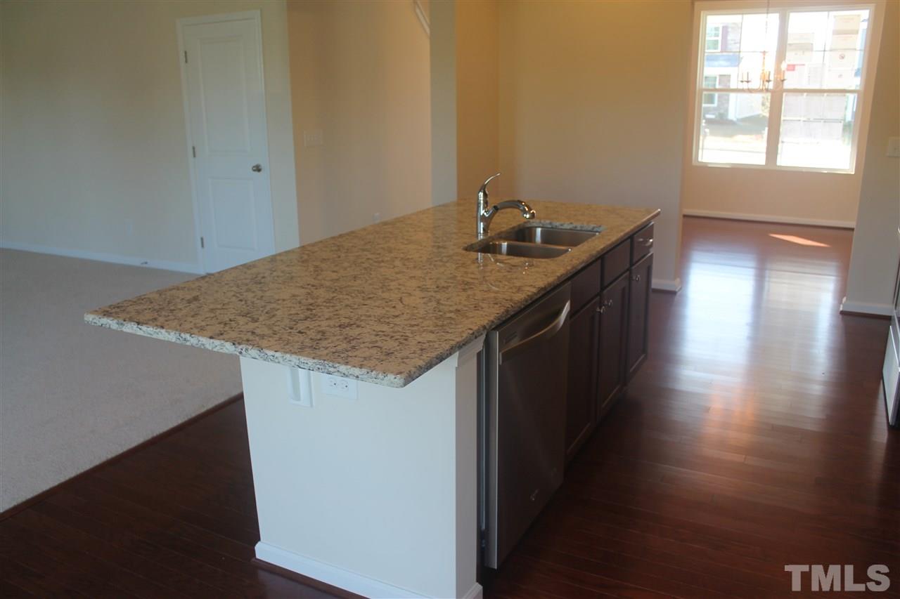 104 Hope Valley Road Knightdale, NC 27545 - Photo 9 of 15 a kitchen with a sink a counter space and a window