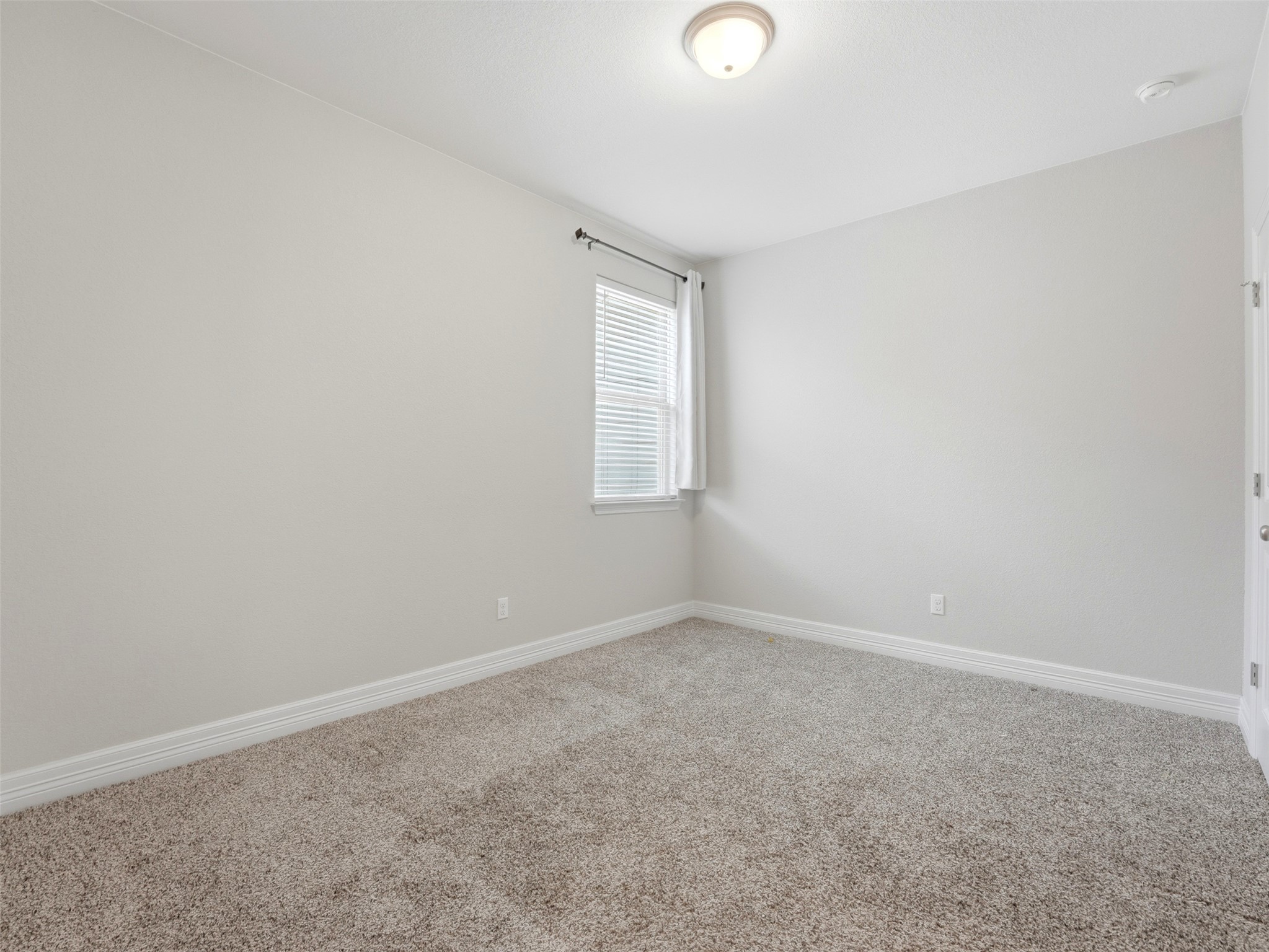2132 Ringstaff Road Leander, TX 78641 - Photo 26 of 39 A spacious room offers comfortable carpeting, ready for your personal touches.