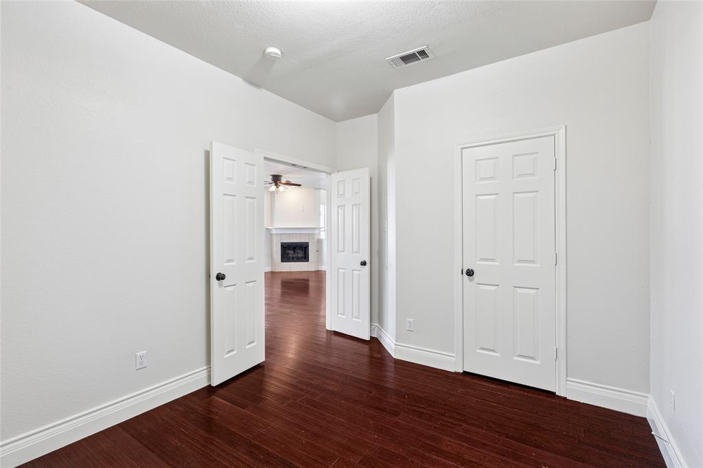 4509 Gila Bend Lane Fort Worth, TX 76137 - Photo 15 of 28 a view of an empty room with wooden floor