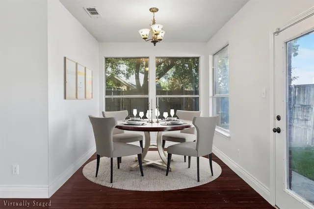 a kitchen with stainless steel appliances a refrigerator and a stove top oven