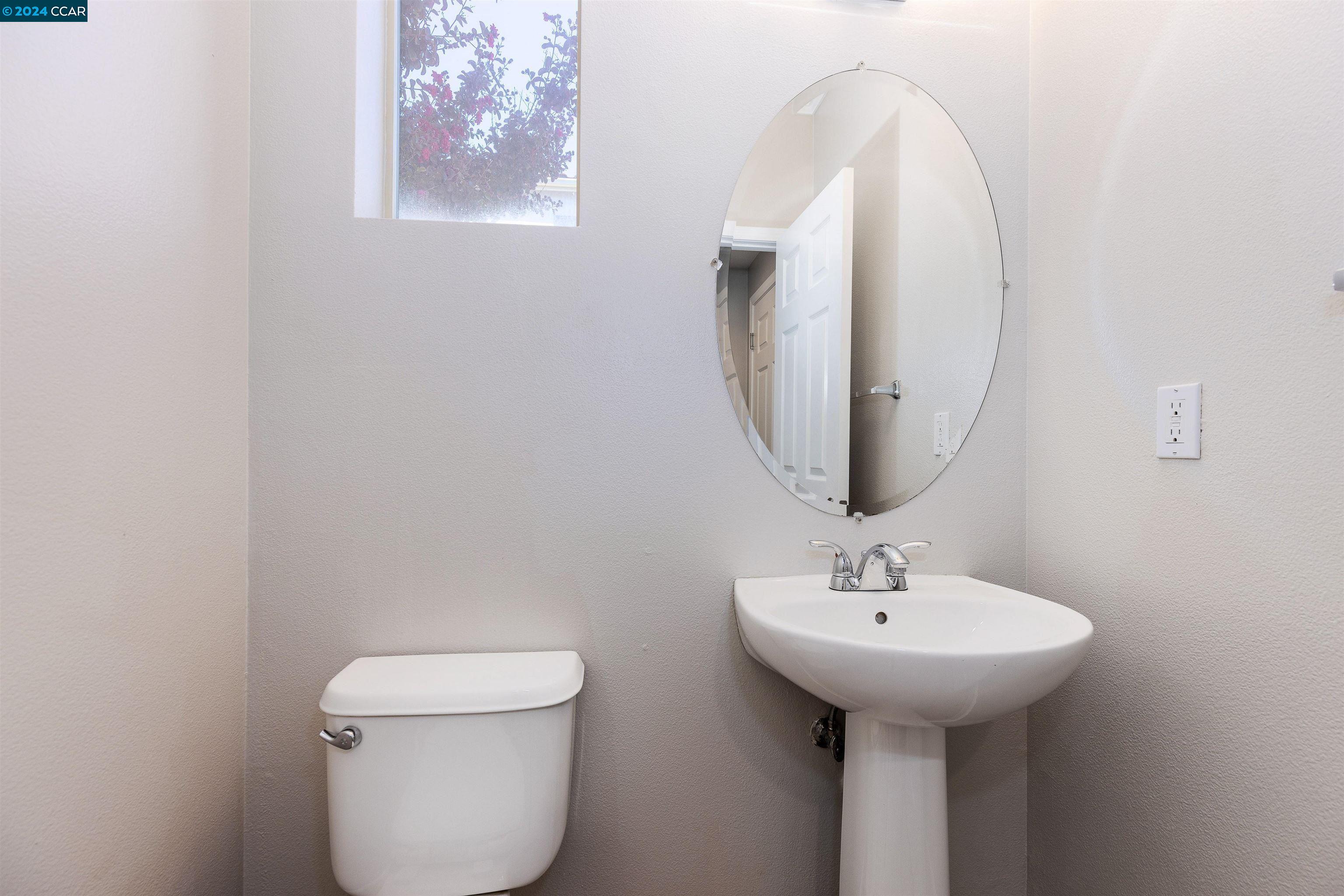 2000 Amaryllis San Ramon, CA 94583 - Photo 12 of 20 a bathroom with a toilet sink and mirror