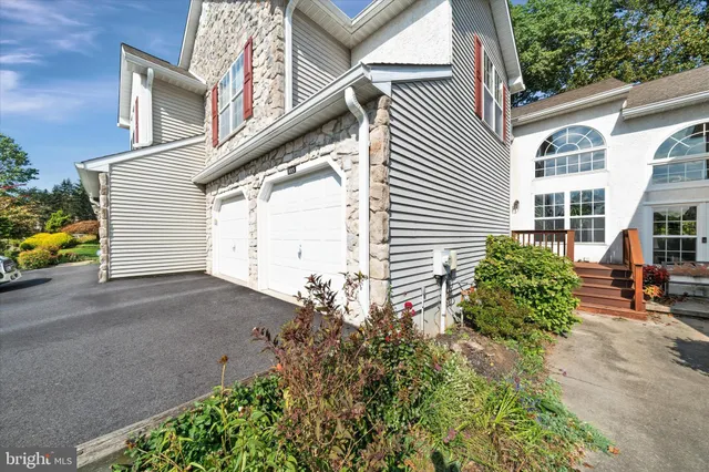 a view of a house with a street