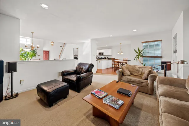 a living room with furniture rug and couch