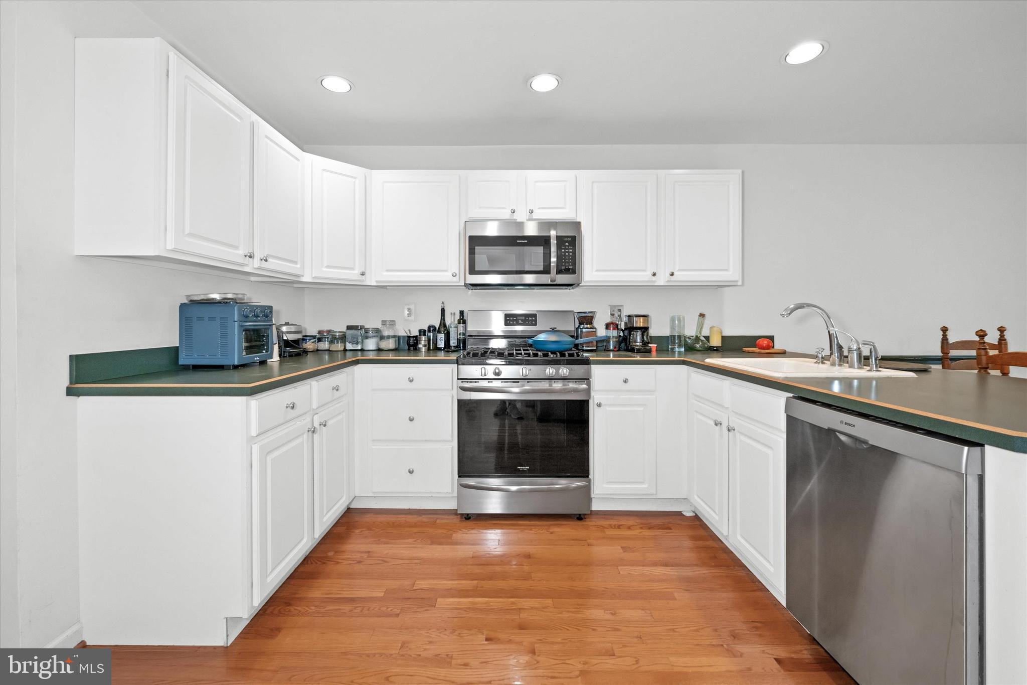 1015 Adams Way West Chester, PA 19382 - Photo 22 of 48 a kitchen with stainless steel appliances granite countertop a stove sink and cabinets