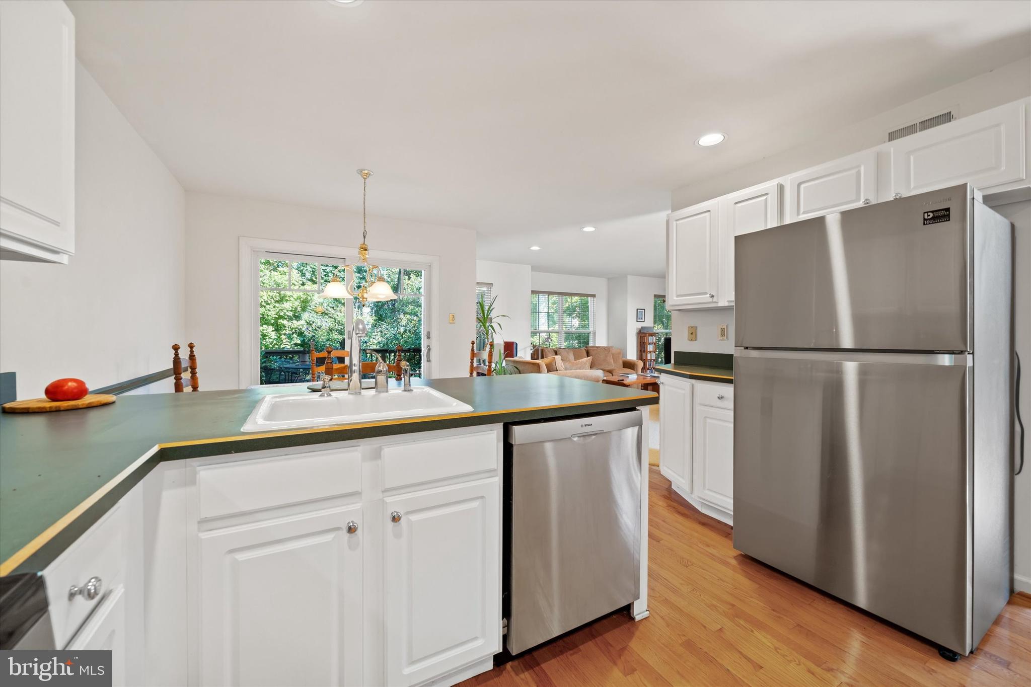 1015 Adams Way West Chester, PA 19382 - Photo 25 of 48 a kitchen with kitchen island white cabinets a refrigerator and a sink