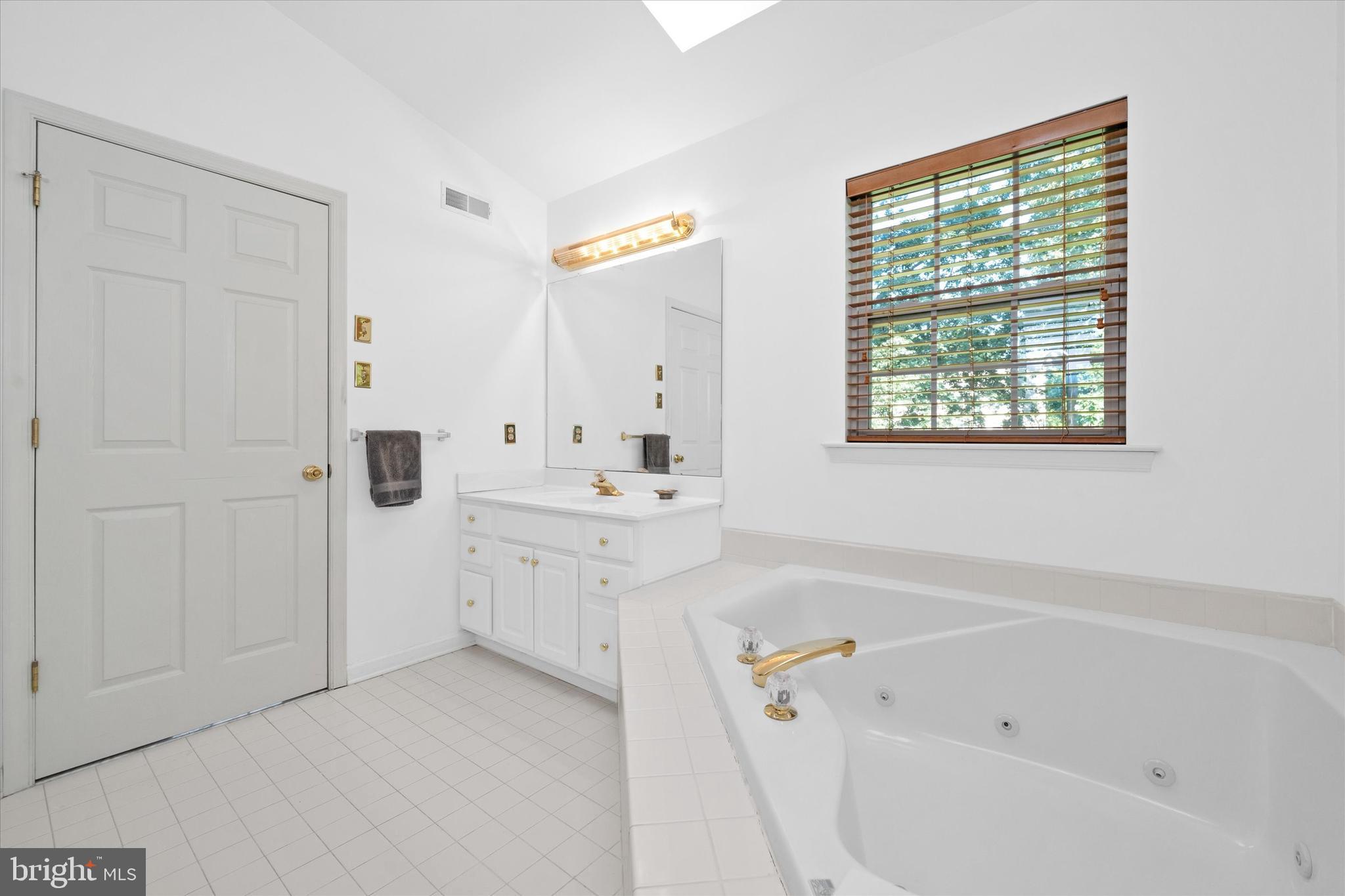 1015 Adams Way West Chester, PA 19382 - Photo 31 of 48 a spacious bathroom with a tub sink and mirror