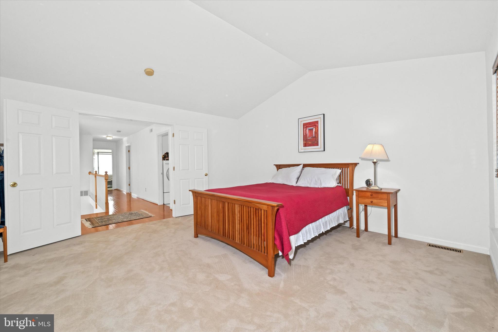 1015 Adams Way West Chester, PA 19382 - Photo 35 of 48 a bedroom with a bed and a lamp