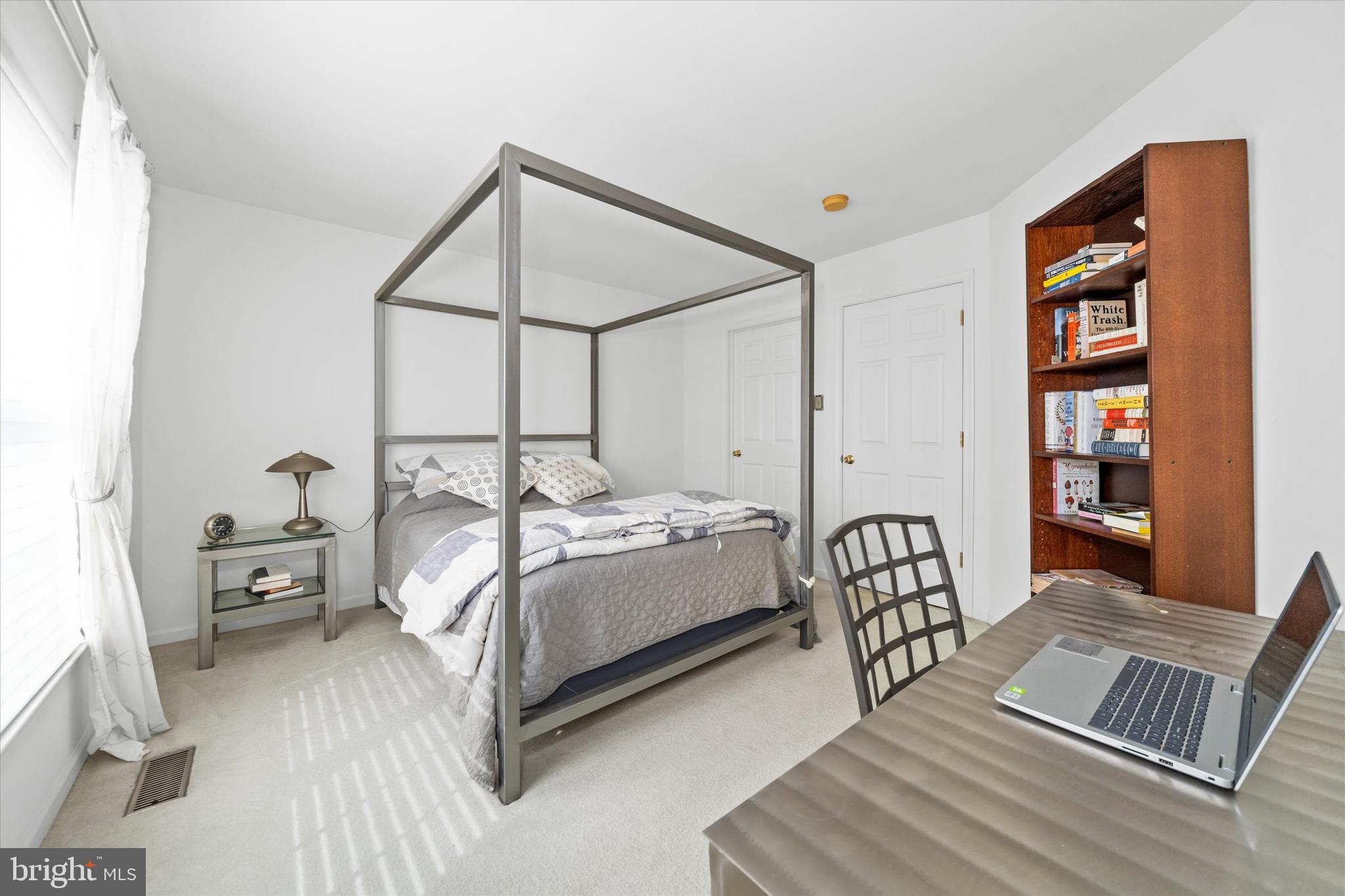 1015 Adams Way West Chester, PA 19382 - Photo 40 of 48 a bedroom with a bed window and a book shelf
