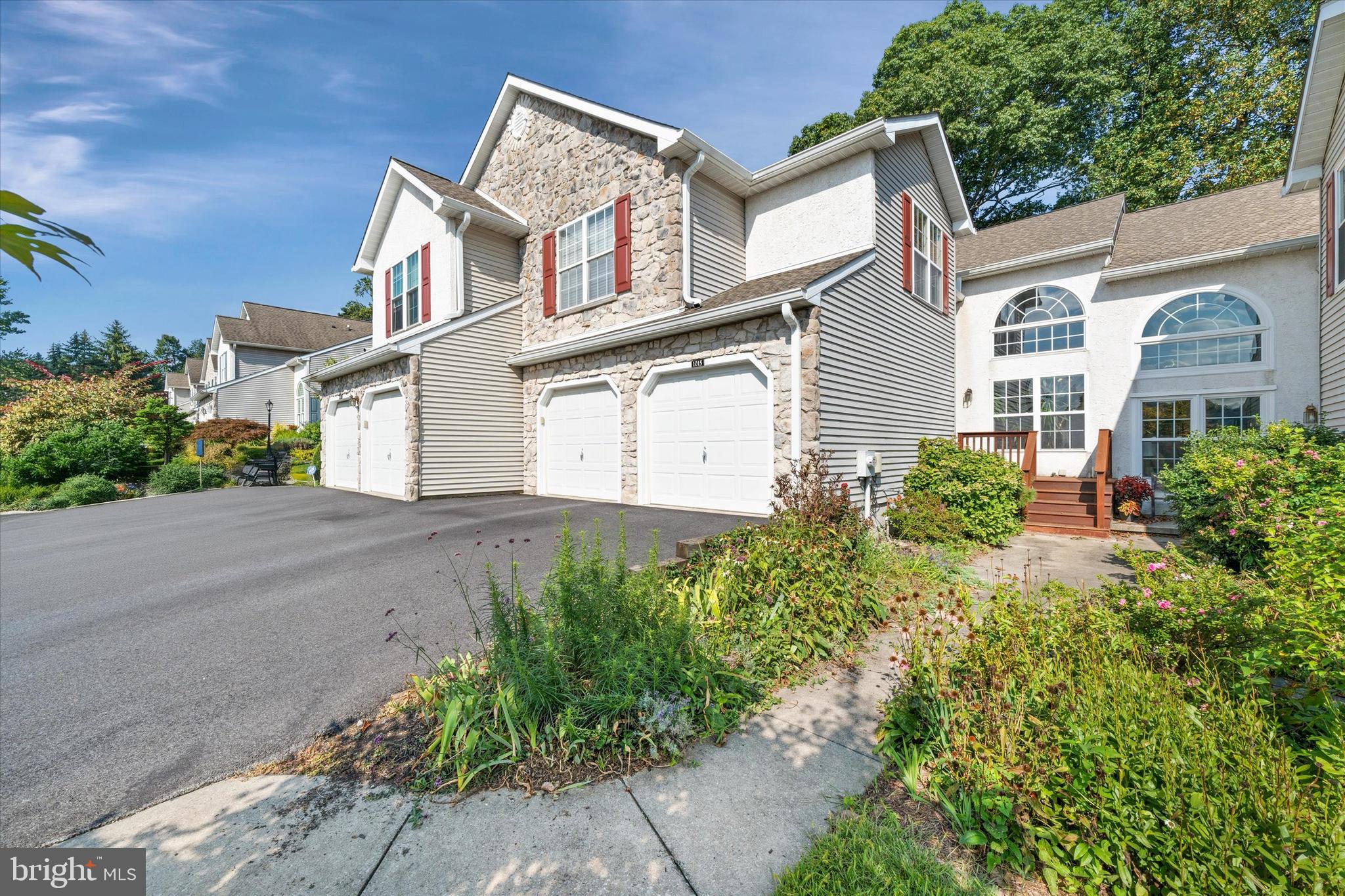 1015 Adams Way West Chester, PA 19382 - Photo 4 of 48 front view of a house with a yard
