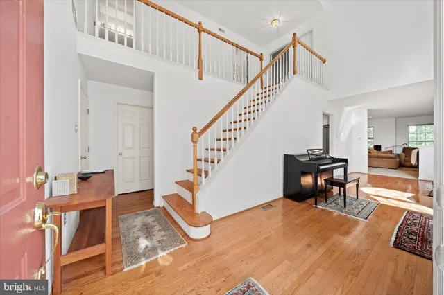a view of a livingroom with furniture and staircase