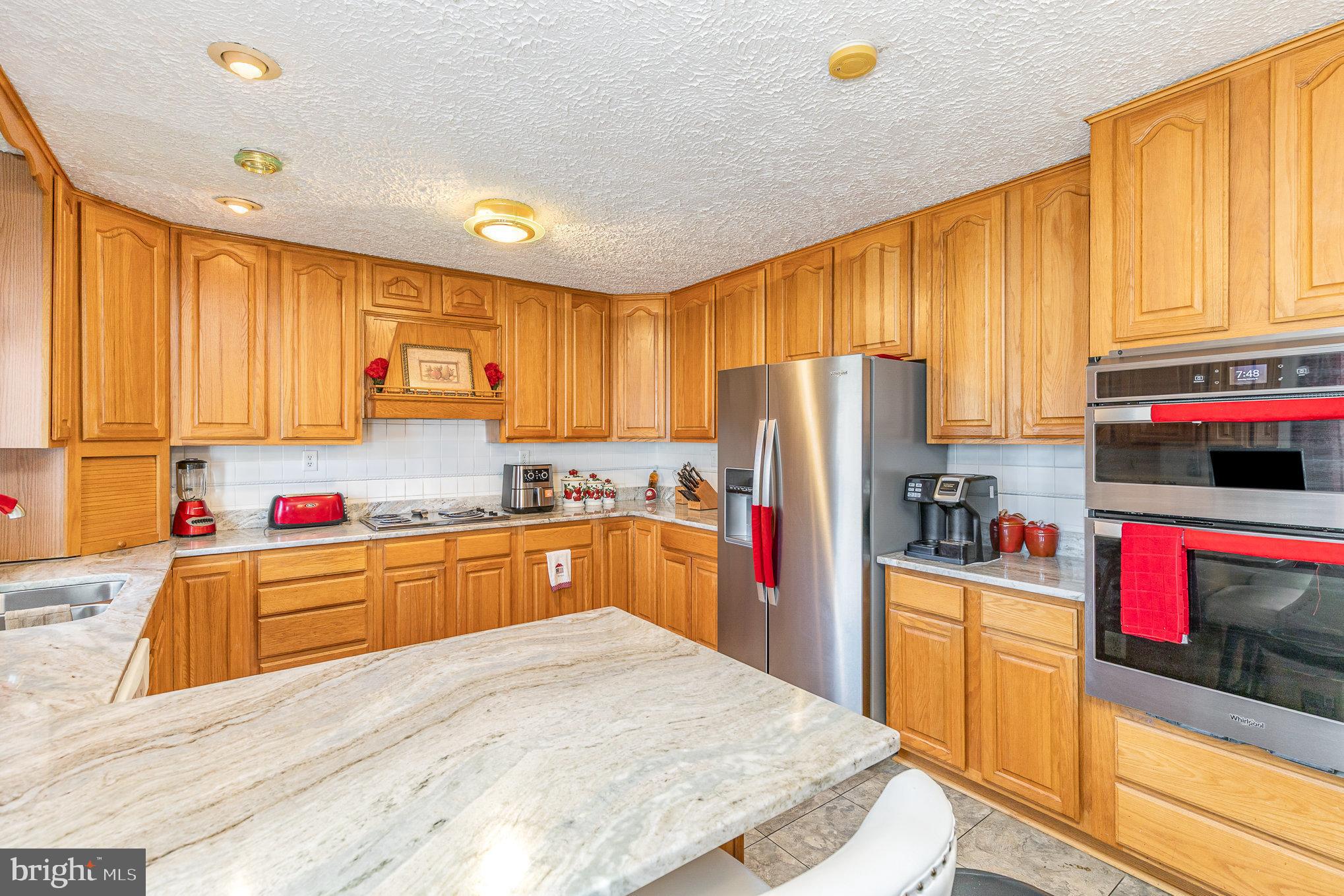 9121 Will Loop King George, VA 22485 - Photo 16 of 52 a kitchen with cabinets a sink and appliances