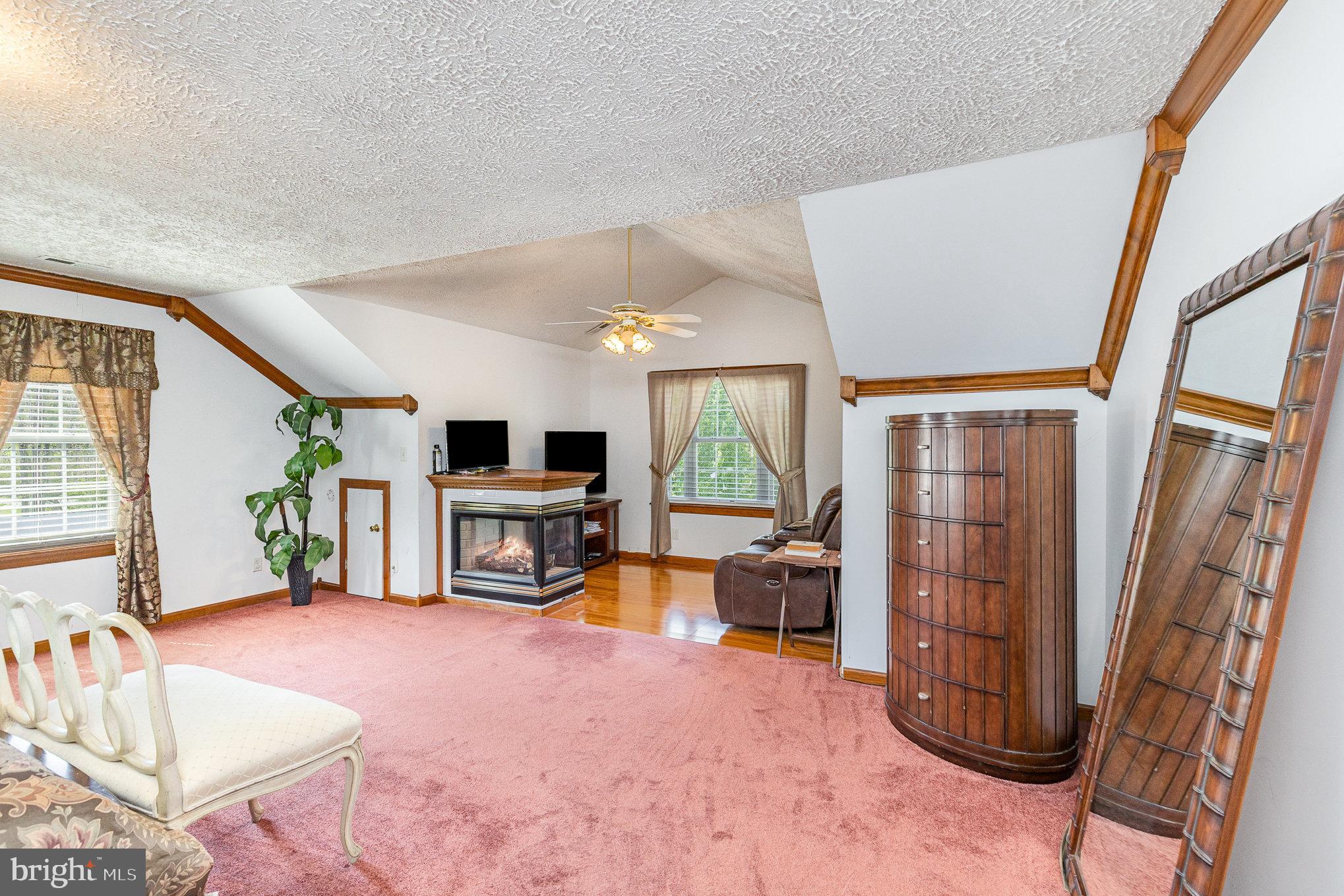 9121 Will Loop King George, VA 22485 - Photo 20 of 52 a living room with furniture a window and a flat screen tv
