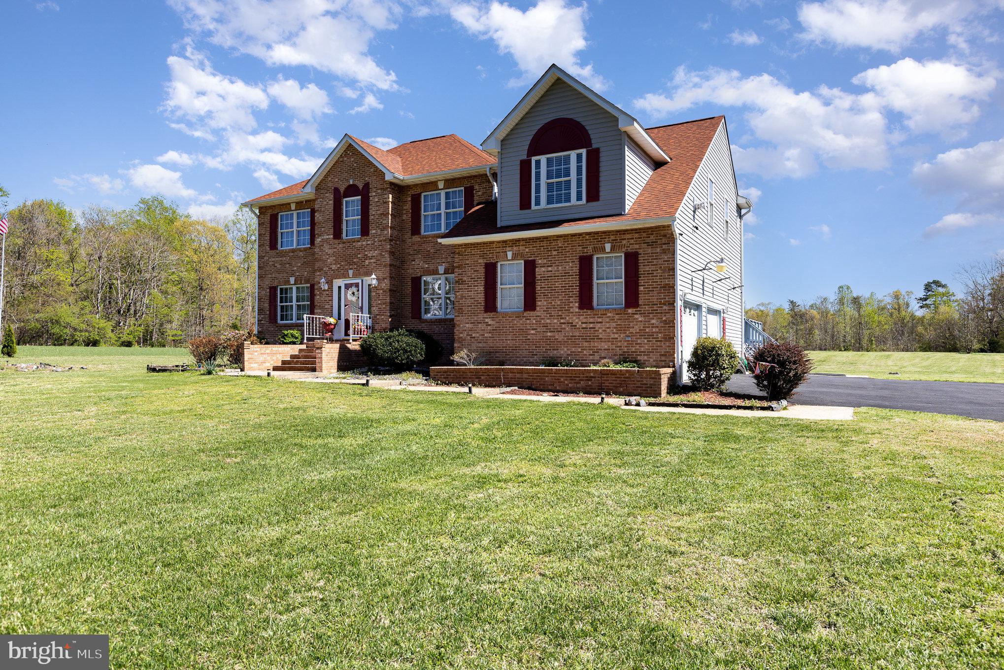 9121 Will Loop King George, VA 22485 - Photo 2 of 52 a front view of the house with a yard