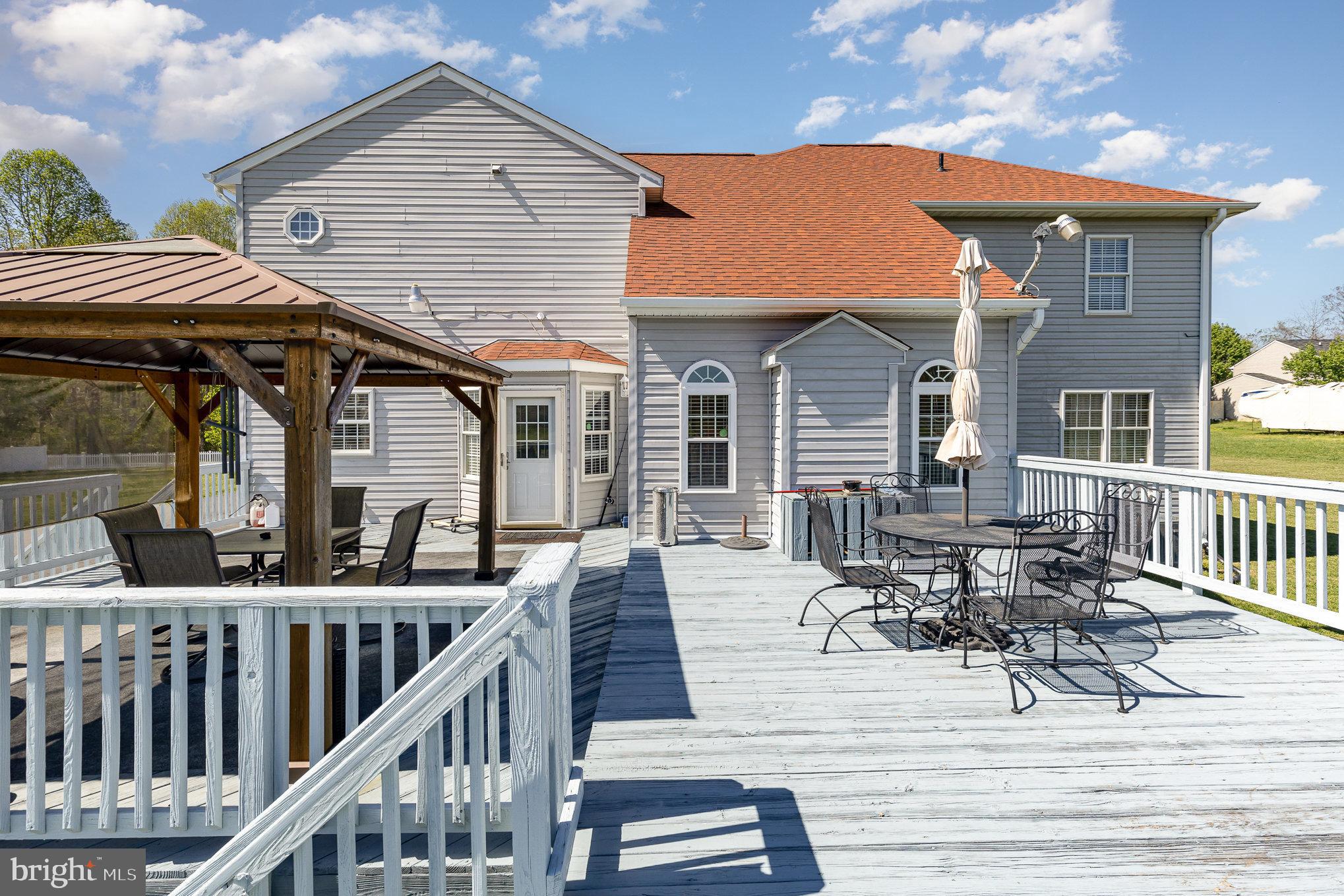 9121 Will Loop King George, VA 22485 - Photo 35 of 52 a view of a house with wooden deck and furniture
