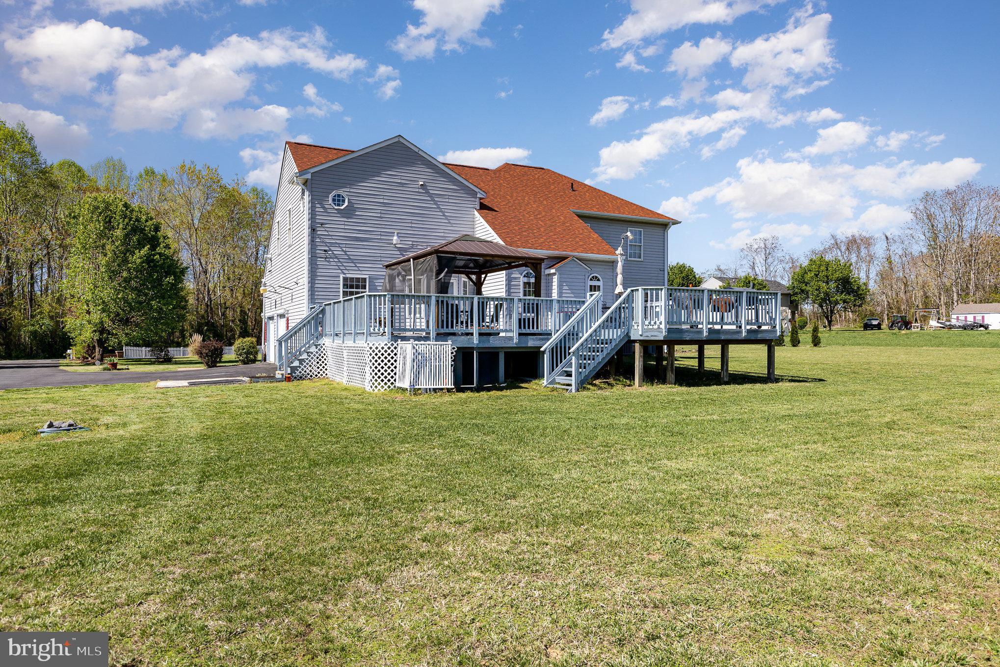 9121 Will Loop King George, VA 22485 - Photo 37 of 52 a front view of a house with a garden and plants