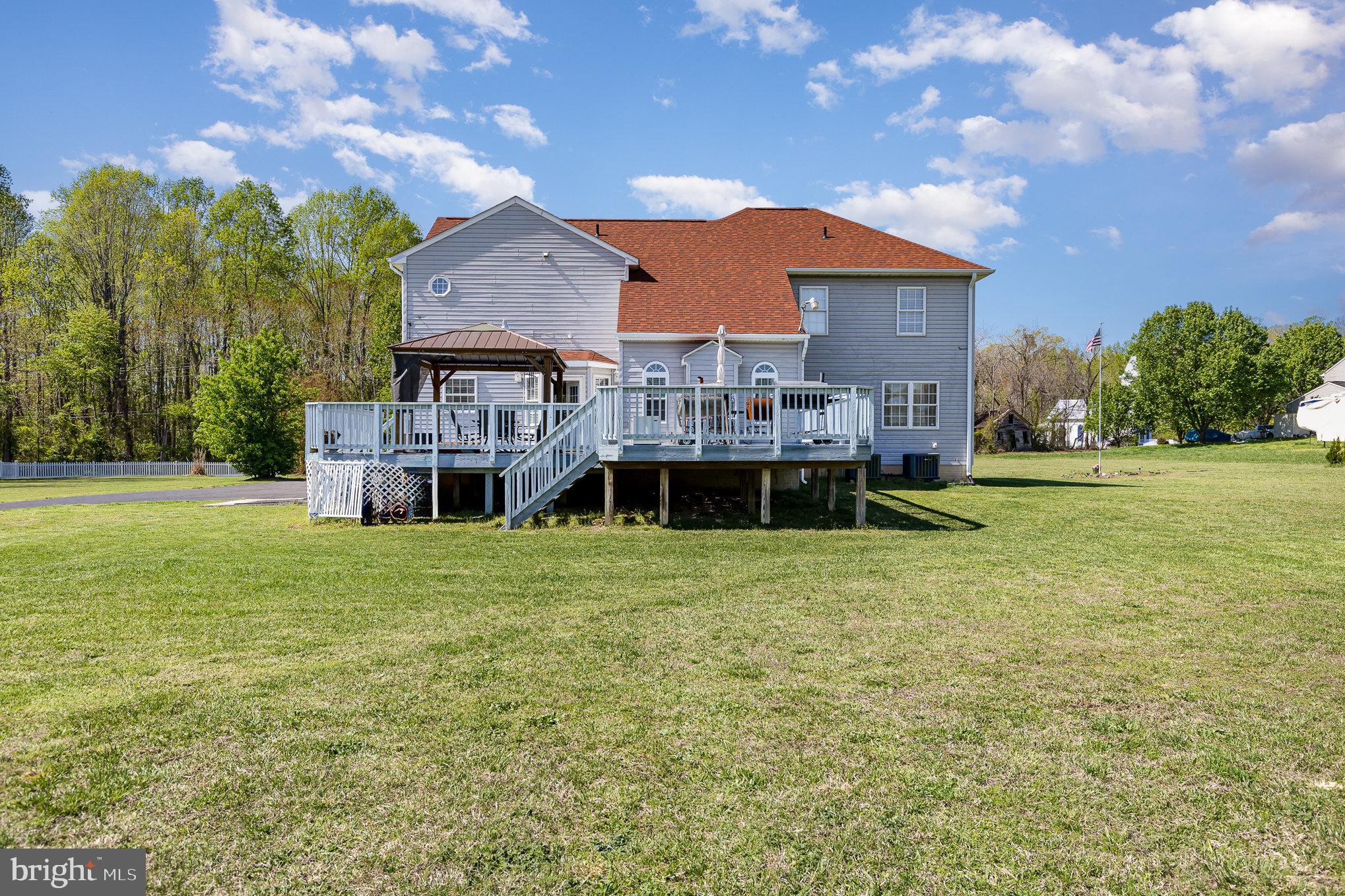 9121 Will Loop King George, VA 22485 - Photo 39 of 52 a front view of a house with a garden and deck