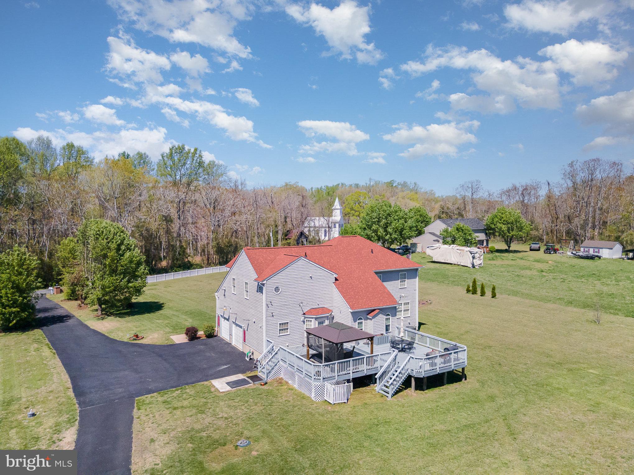 9121 Will Loop King George, VA 22485 - Photo 41 of 52 a view of a garden with lawn chairs