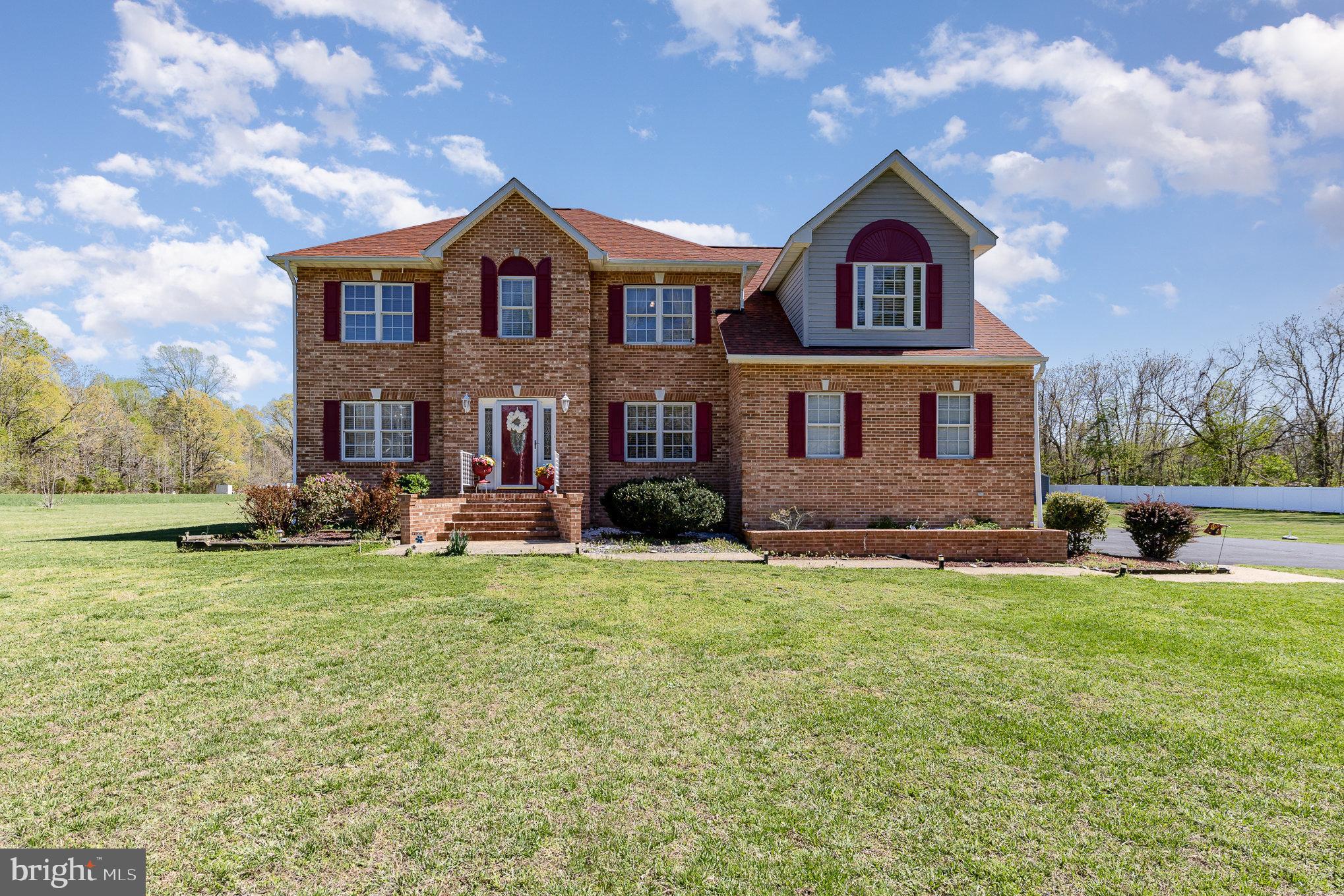 9121 Will Loop King George, VA 22485 - Photo 6 of 52 a view of a big house with a big yard and large trees