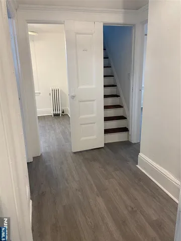 a view of a hallway with staircase