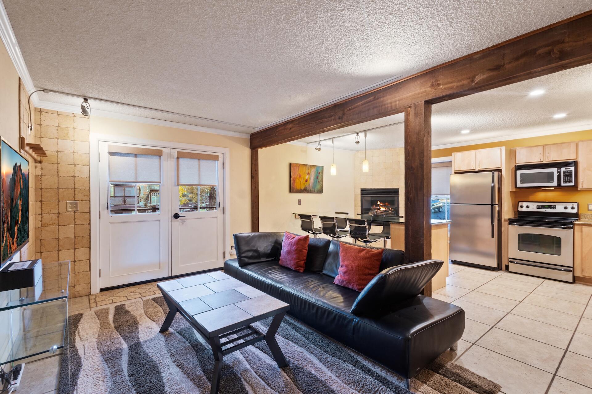 260 South Aspen Street, Unit D 2 Telluride, CO 81435 - Photo 11 of 30 a living room with furniture and a flat screen tv