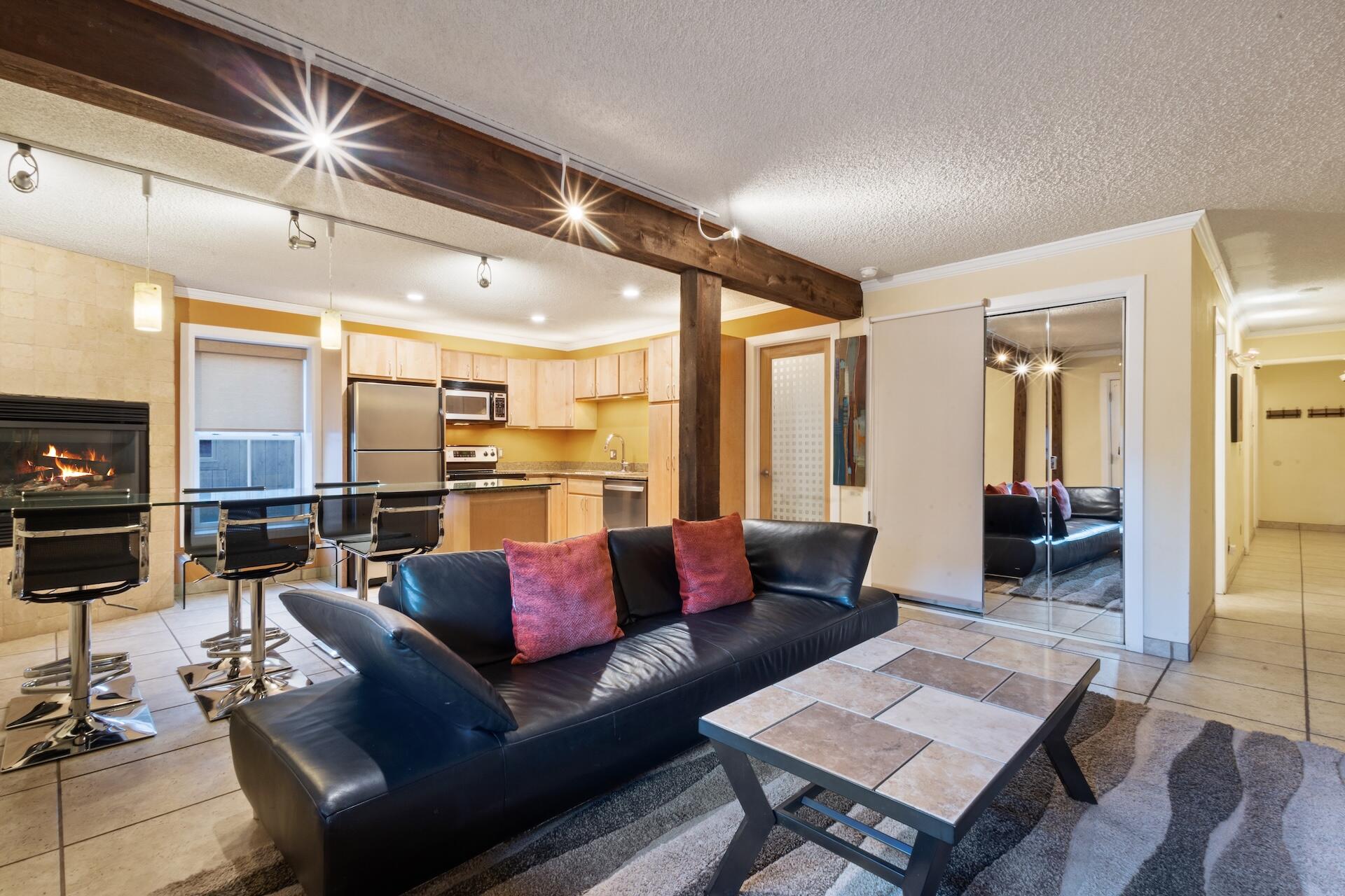 260 South Aspen Street, Unit D 2 Telluride, CO 81435 - Photo 15 of 30 a living room with furniture and a flat screen tv