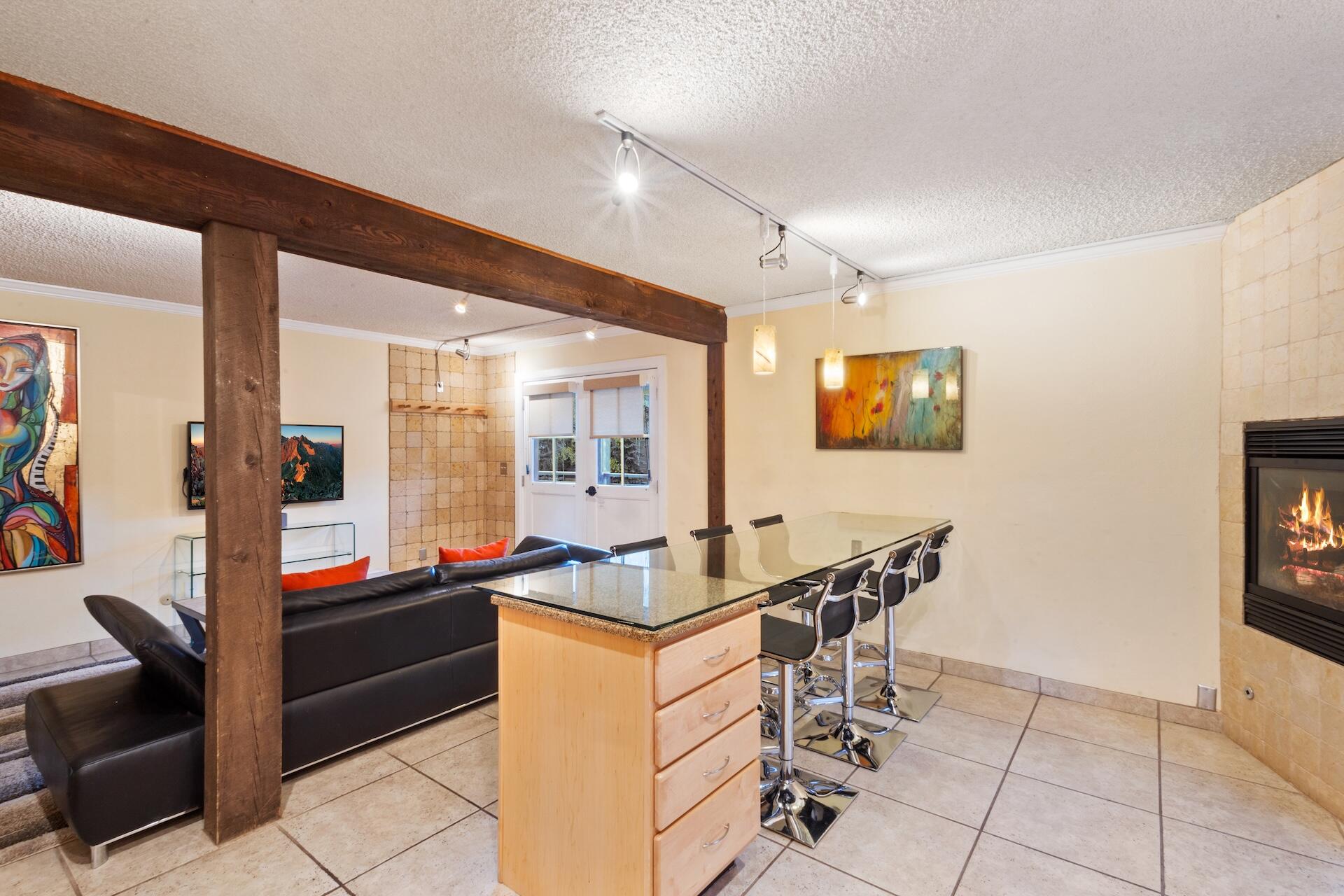 260 South Aspen Street, Unit D 2 Telluride, CO 81435 - Photo 16 of 30 a kitchen with granite countertop sink and cabinets