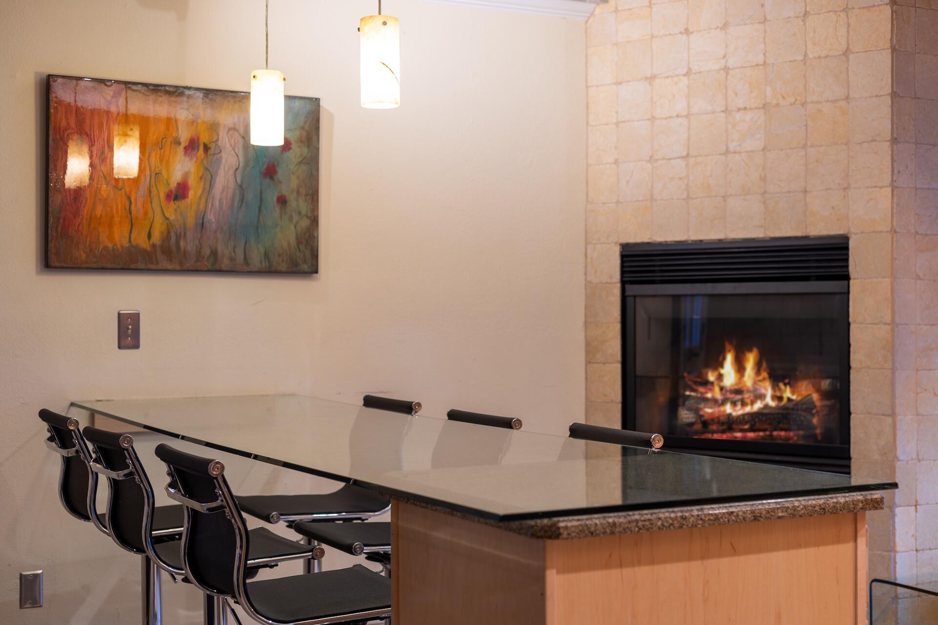 260 South Aspen Street, Unit D 2 Telluride, CO 81435 - Photo 17 of 30 a room with a fireplace and wall painting