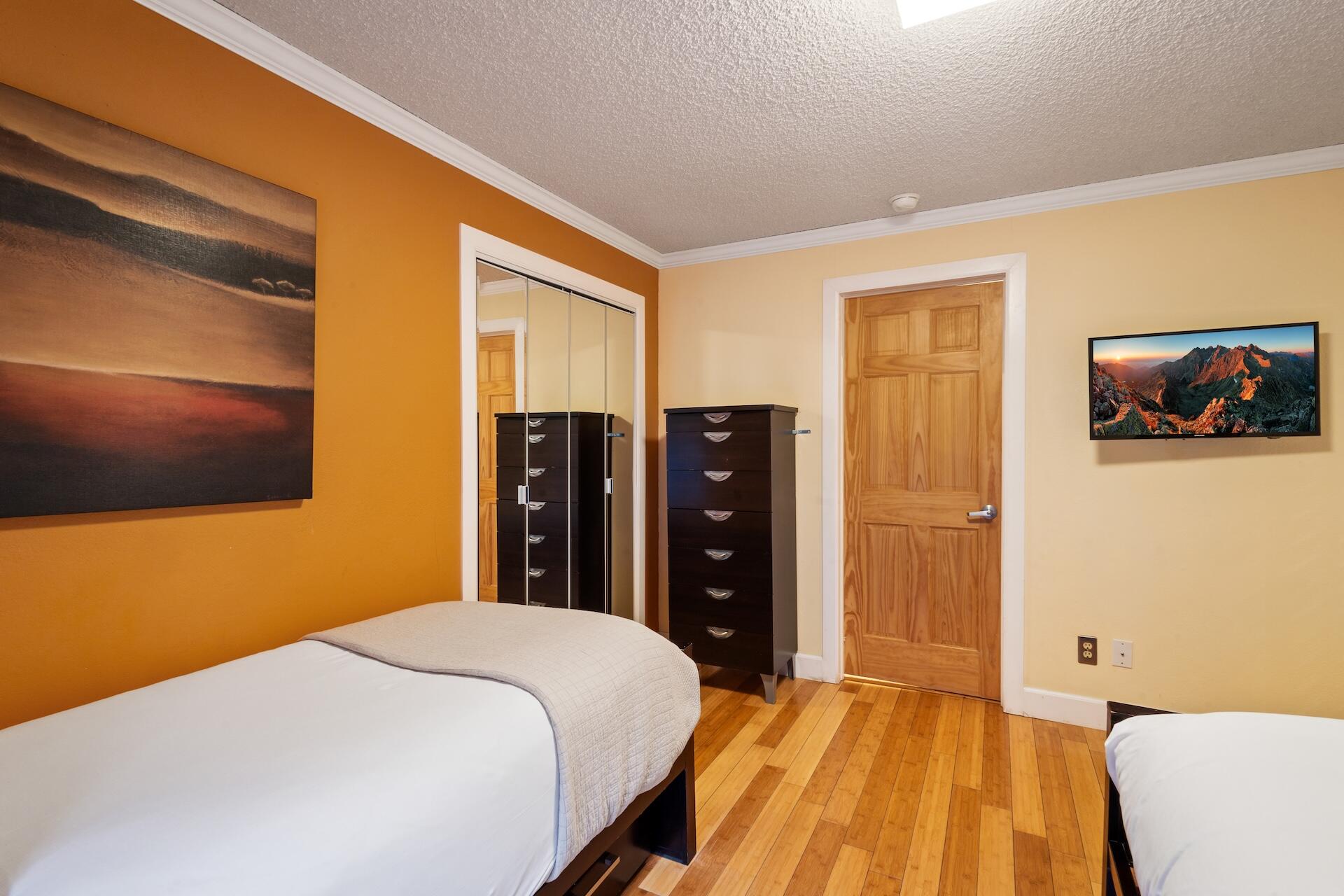 260 South Aspen Street, Unit D 2 Telluride, CO 81435 - Photo 20 of 30 a bedroom with a bed and a flat screen tv