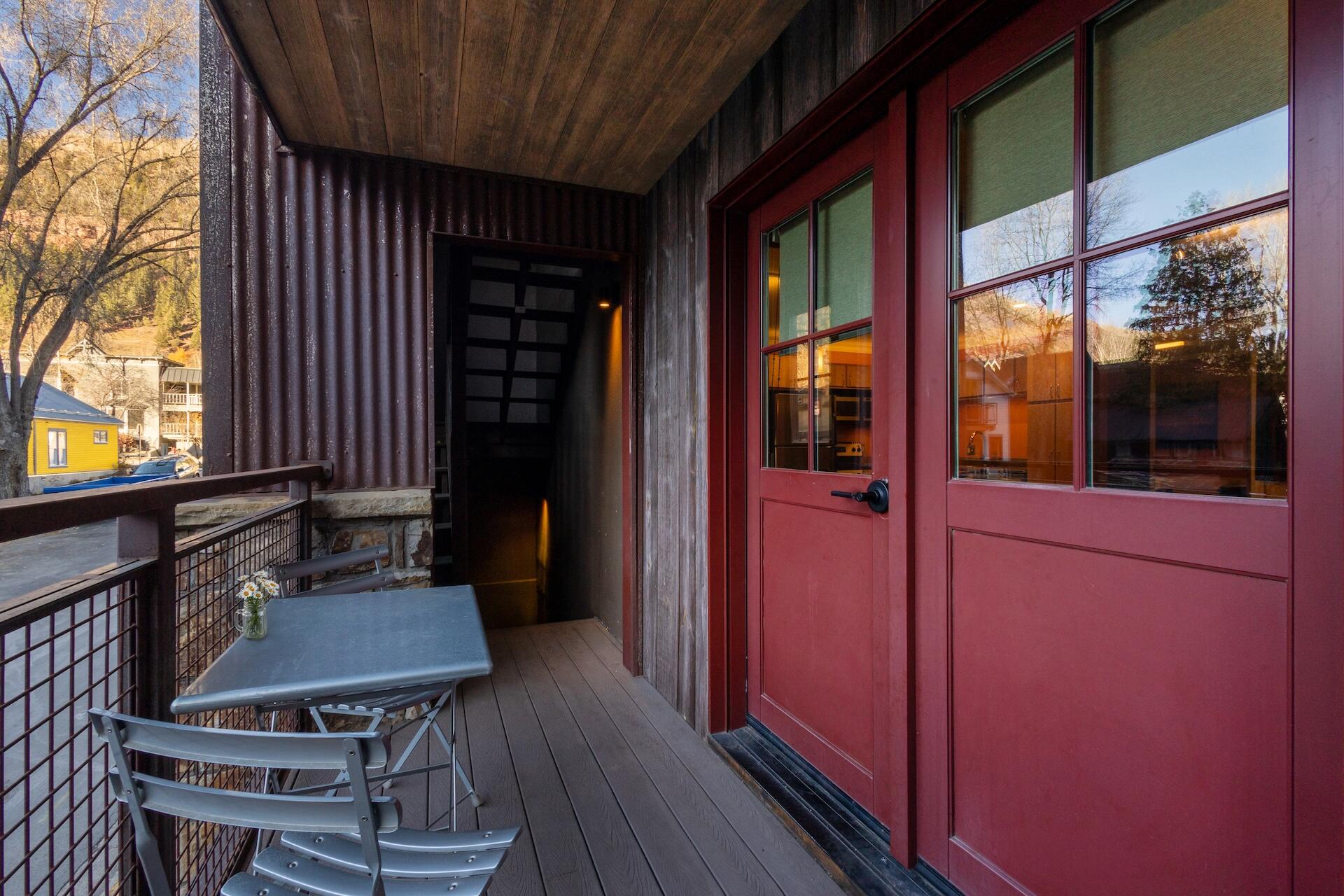 260 South Aspen Street, Unit D 2 Telluride, CO 81435 - Photo 5 of 30 a view of a house with a chairs and table in a patio