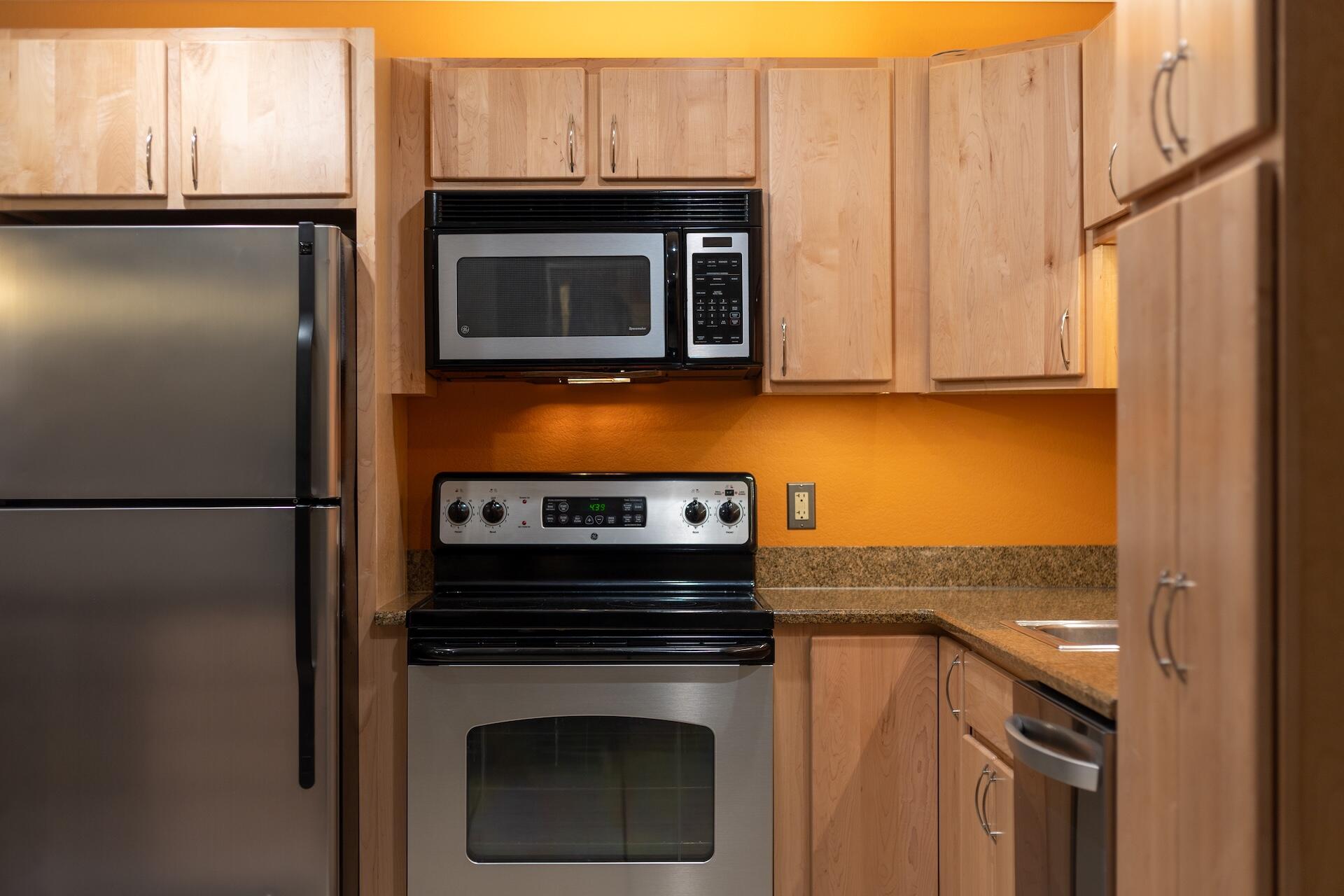260 South Aspen Street, Unit D 2 Telluride, CO 81435 - Photo 6 of 30 a kitchen with a stove microwave and refrigerator