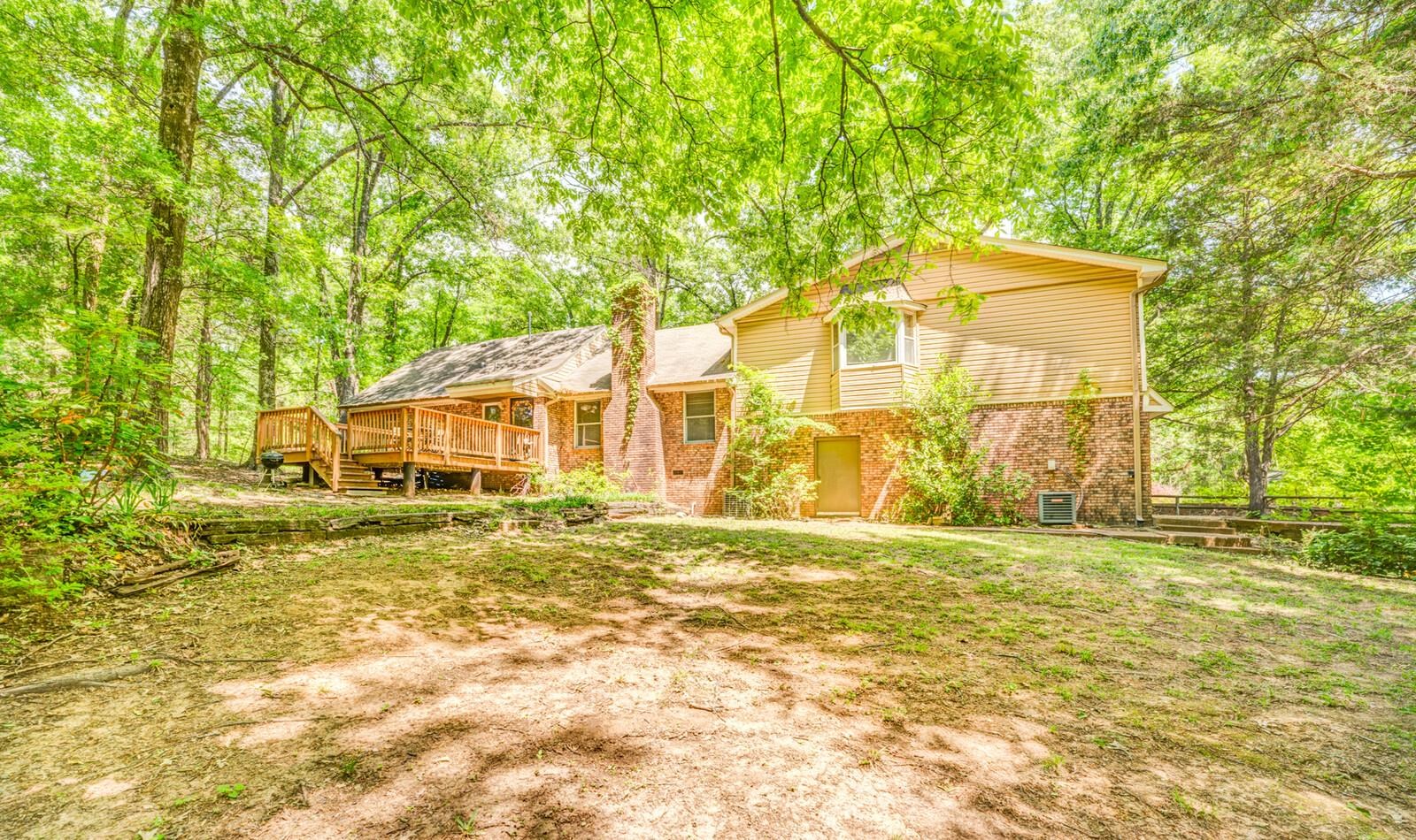 8651 Baylor Road Bartlett, TN 38002 - Photo 25 of 29 a front view of a house with a garden
