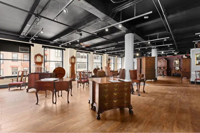 a living room with lots of furniture and a table