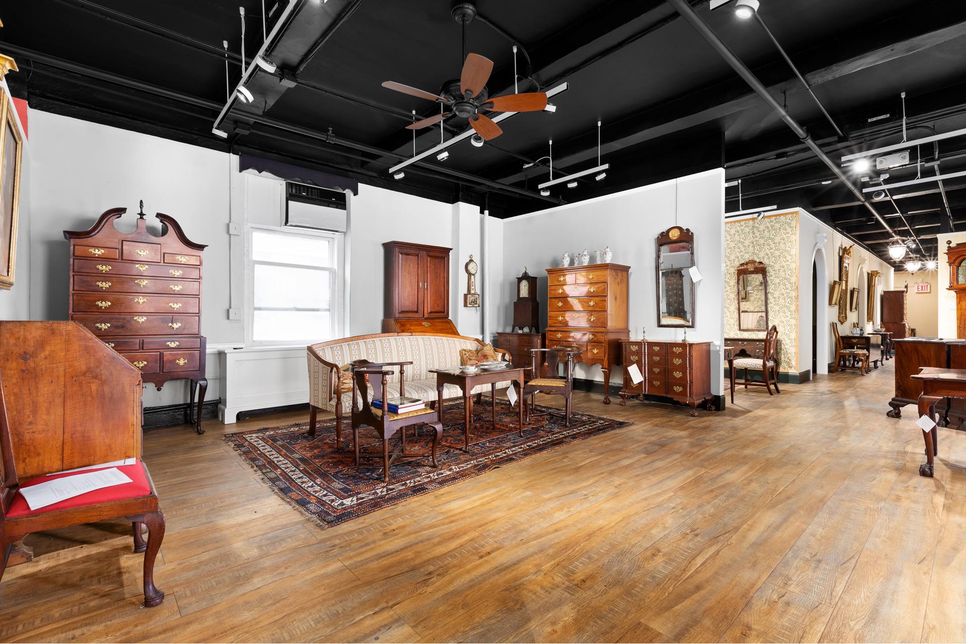 227 West 17th Street, Unit 3 Manhattan, NY 10011 - Photo 19 of 26 a living room with furniture a flat screen tv and a table