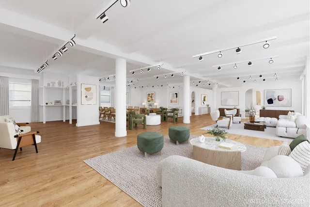 a bedroom with a bed couch and a large window