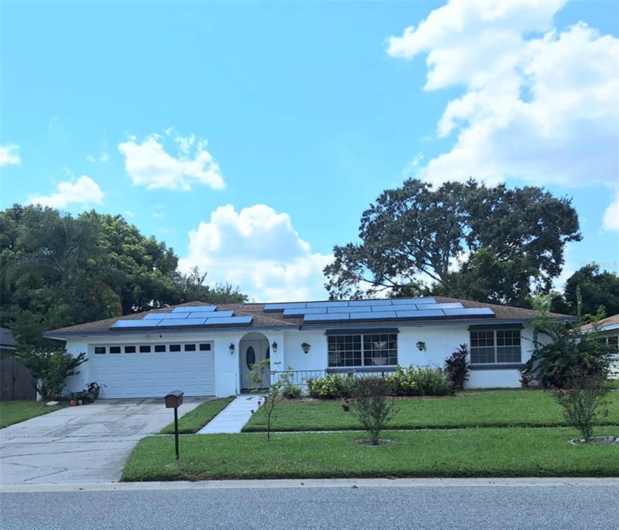 514 Spring Oaks Boulevard Altamonte Springs, FL 32714 - Photo 1 of 16 a view of a house with a yard and potted plants
