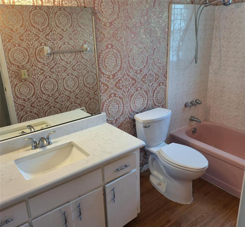 514 Spring Oaks Boulevard Altamonte Springs, FL 32714 - Photo 11 of 16 a bathroom with a toilet sink and mirror