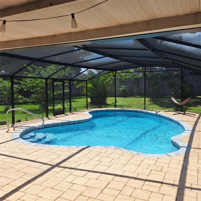 514 Spring Oaks Boulevard Altamonte Springs, FL 32714 - Photo 12 of 16 a swimming pool with wooden fence