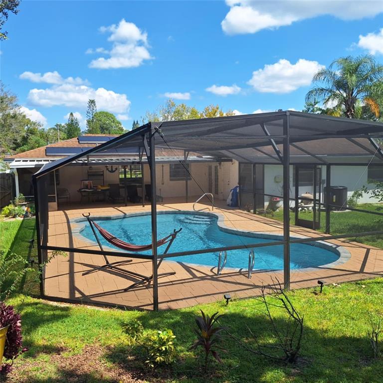 514 Spring Oaks Boulevard Altamonte Springs, FL 32714 - Photo 13 of 16 a view of a patio with a table and chairs
