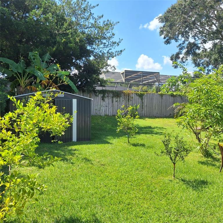 514 Spring Oaks Boulevard Altamonte Springs, FL 32714 - Photo 14 of 16 a view of a garden with a fountain