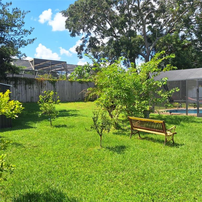 514 Spring Oaks Boulevard Altamonte Springs, FL 32714 - Photo 15 of 16 a garden with a bench in the garden