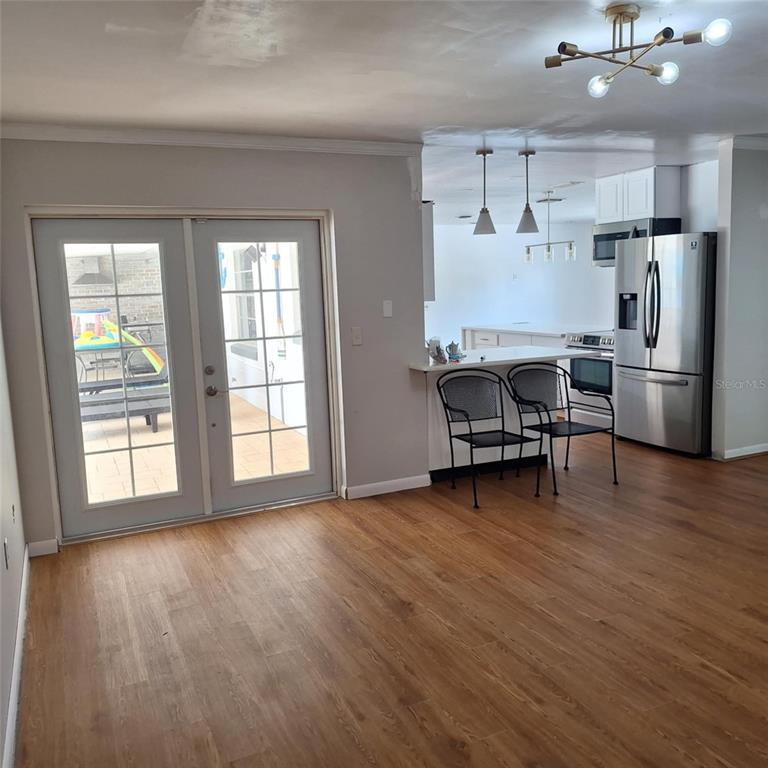 514 Spring Oaks Boulevard Altamonte Springs, FL 32714 - Photo 5 of 16 a view of a workspace with furniture and a kitchen