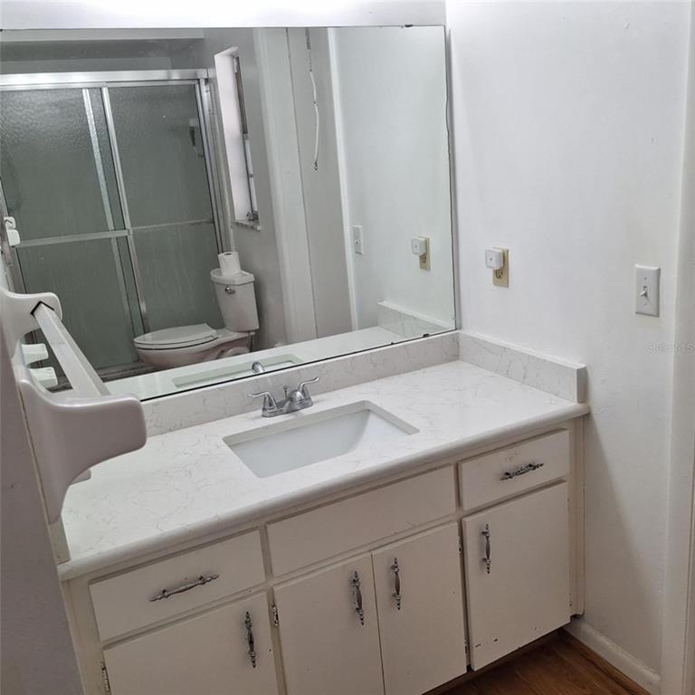 514 Spring Oaks Boulevard Altamonte Springs, FL 32714 - Photo 8 of 16 a bathroom with a sink and mirror