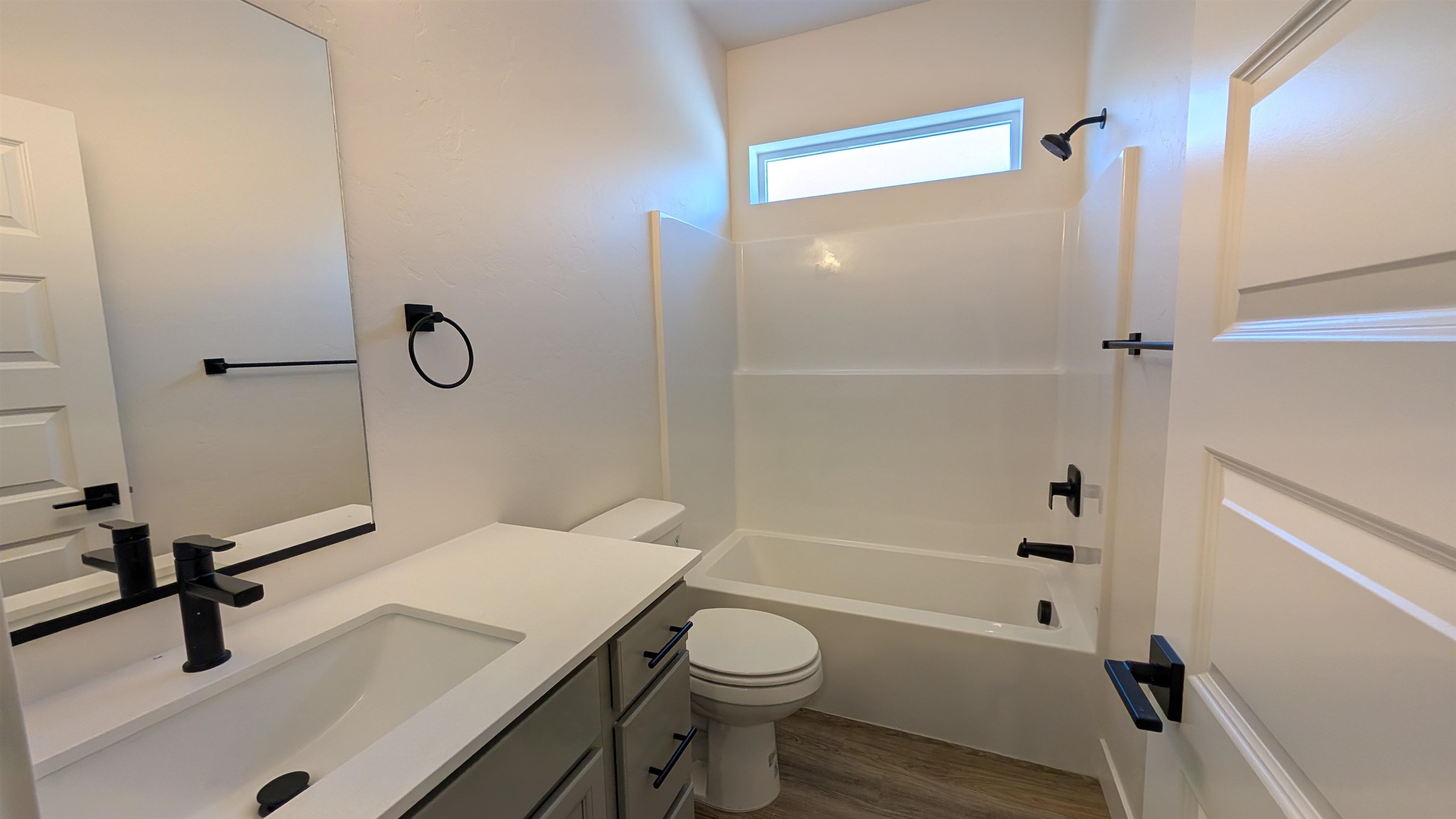 1660 Rusty Rivet Road Fruita, CO 81521 - Photo 8 of 15 a bathroom with a sink a toilet and a mirror
