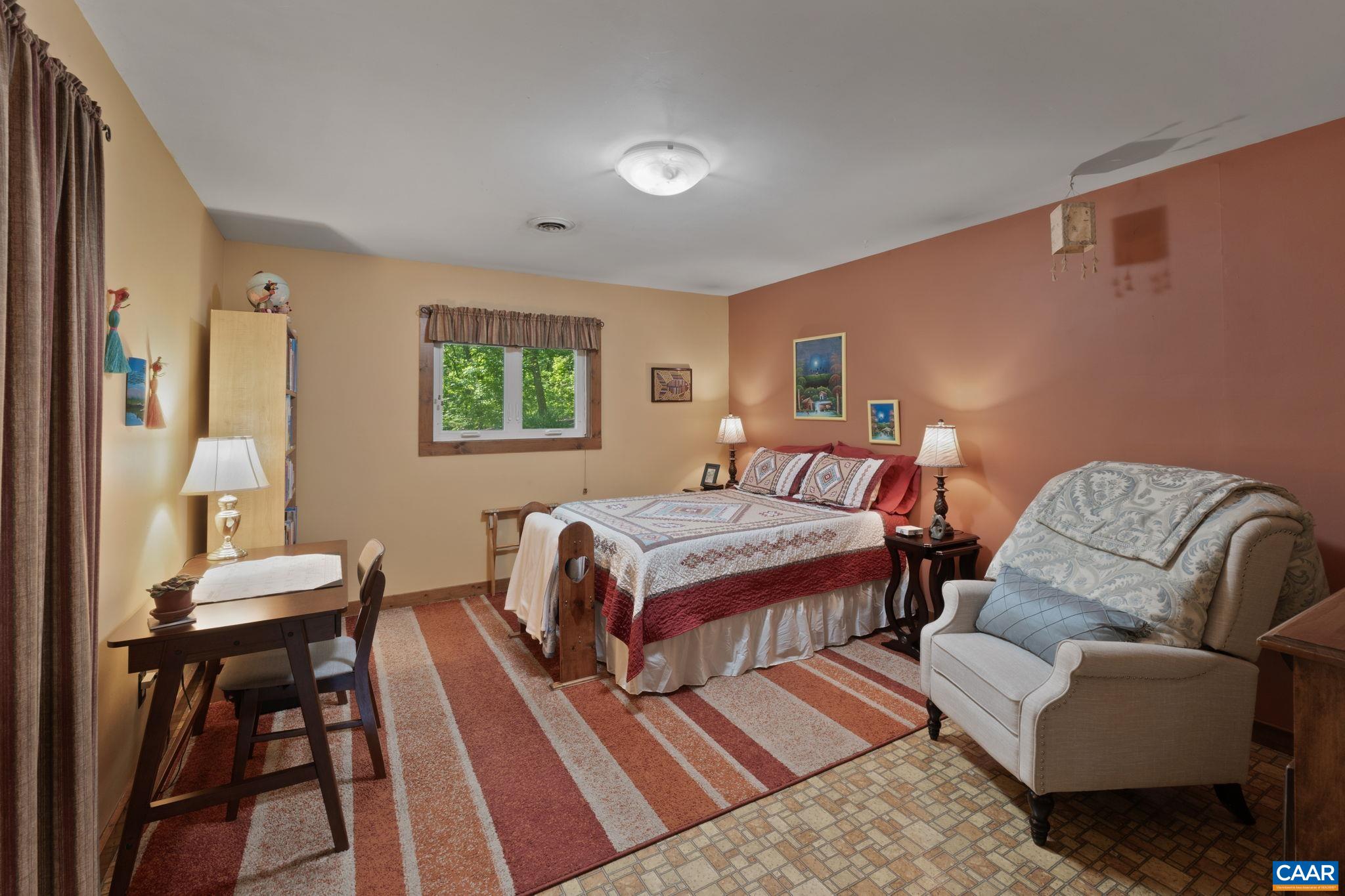2770 Gelletly Road Charlottesville, VA 22902 - Photo 15 of 33 a bedroom with a bed and a couch